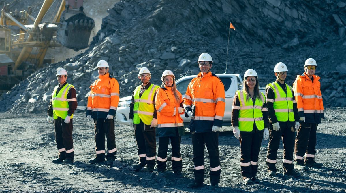 Mining workers in safety gear on site